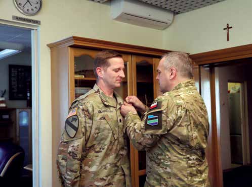 Lt.Gen. Wieslaw Kukula, General Commander of the Polish Armed Forces, awards LTC Robert N. Michaels
        with the Silver Polish Army Medal. (Photo courtesy of authors)